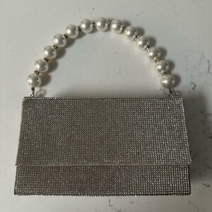 Elegant Silver Clutch with Pearl Handle
